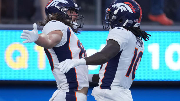 Denver Broncos tight end Greg Dulcich (80) and wide receiver Jerry Jeudy (10) celebrate after a touchdown against the Los Angeles Chargers in the first half at SoFi Stadium.